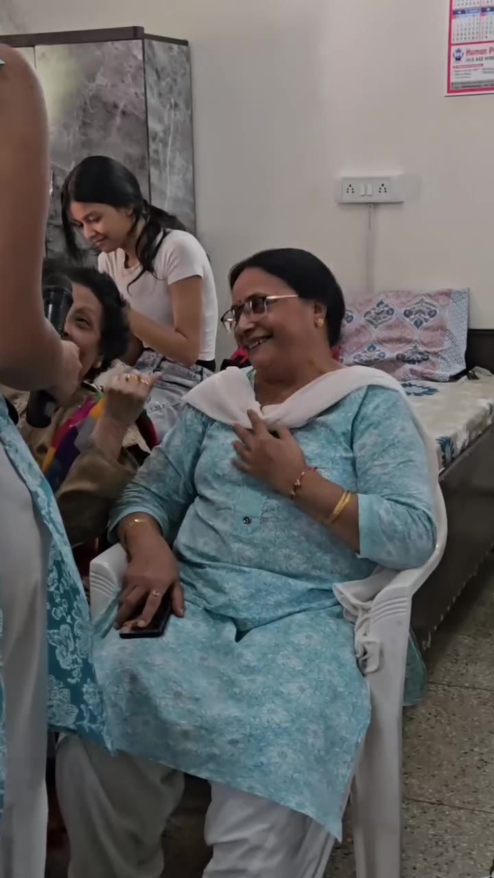 Participants sharing a joyful moment during a visit to Human Peace Foundation Old Age Home
